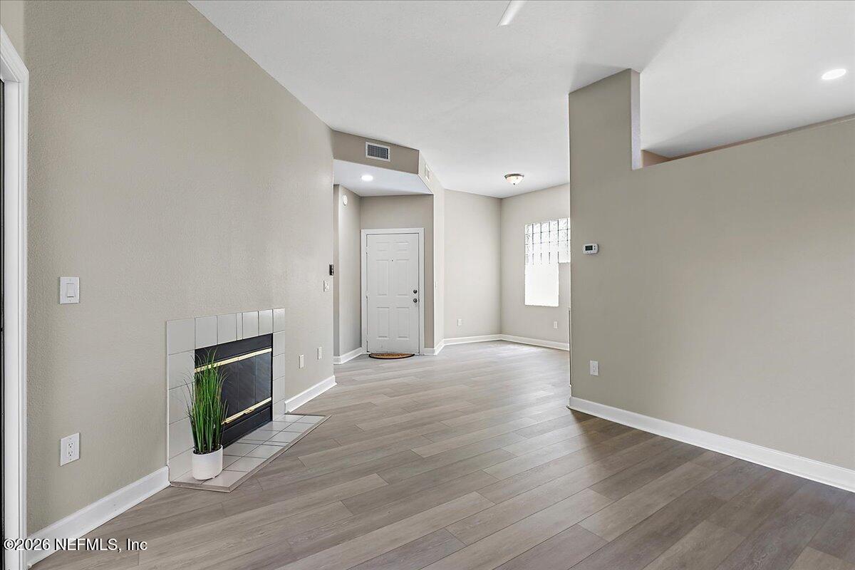10150 Belle Rive Boulevard, Unit 204 Jacksonville, FL 32256 - Photo 2 of 19 02-Foyer to Living Room