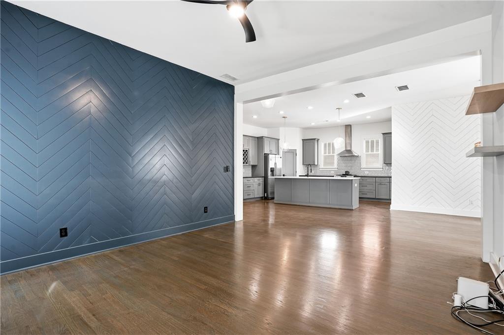 1025 Oak Street Southwest Atlanta, GA 30310 - Photo 12 of 30 a view of a kitchen with a fridge and wooden floor