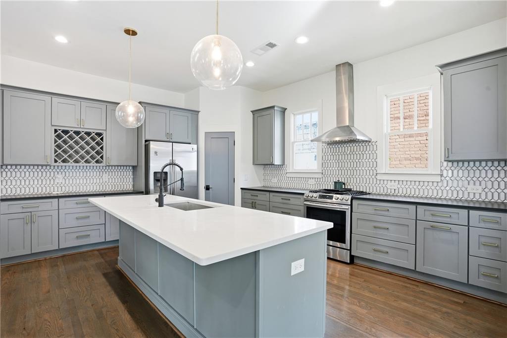 1025 Oak Street Southwest Atlanta, GA 30310 - Photo 2 of 30 a kitchen with a sink stove and cabinets