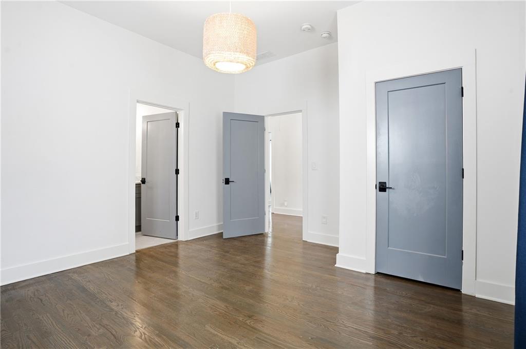 1025 Oak Street Southwest Atlanta, GA 30310 - Photo 21 of 30 a view of an empty room with wooden floor