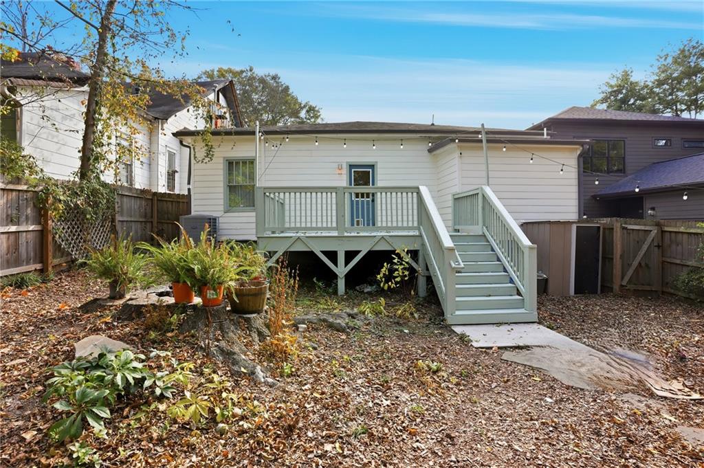1025 Oak Street Southwest Atlanta, GA 30310 - Photo 25 of 30 a view of a house with a wooden fence