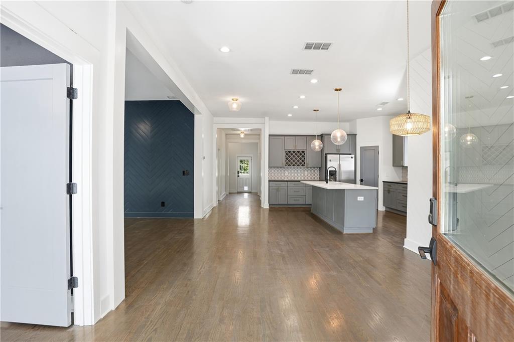 1025 Oak Street Southwest Atlanta, GA 30310 - Photo 7 of 30 a view of kitchen with kitchen island refrigerator sink and white cabinets