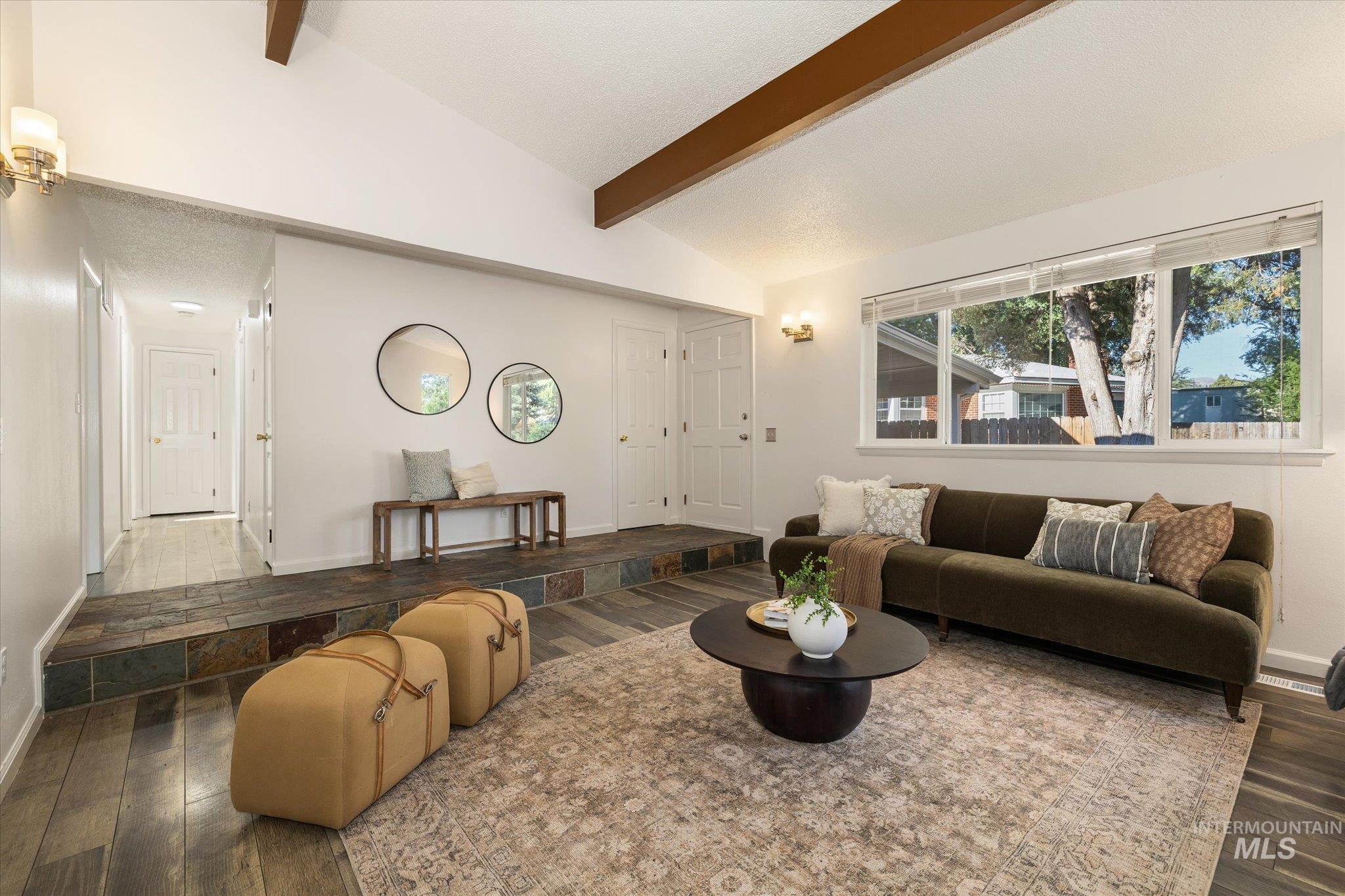 2302 Pendleton Street Boise, ID 83705 - Photo 8 of 35 Vaulted ceilings with exposed wood beams define this spacious living area