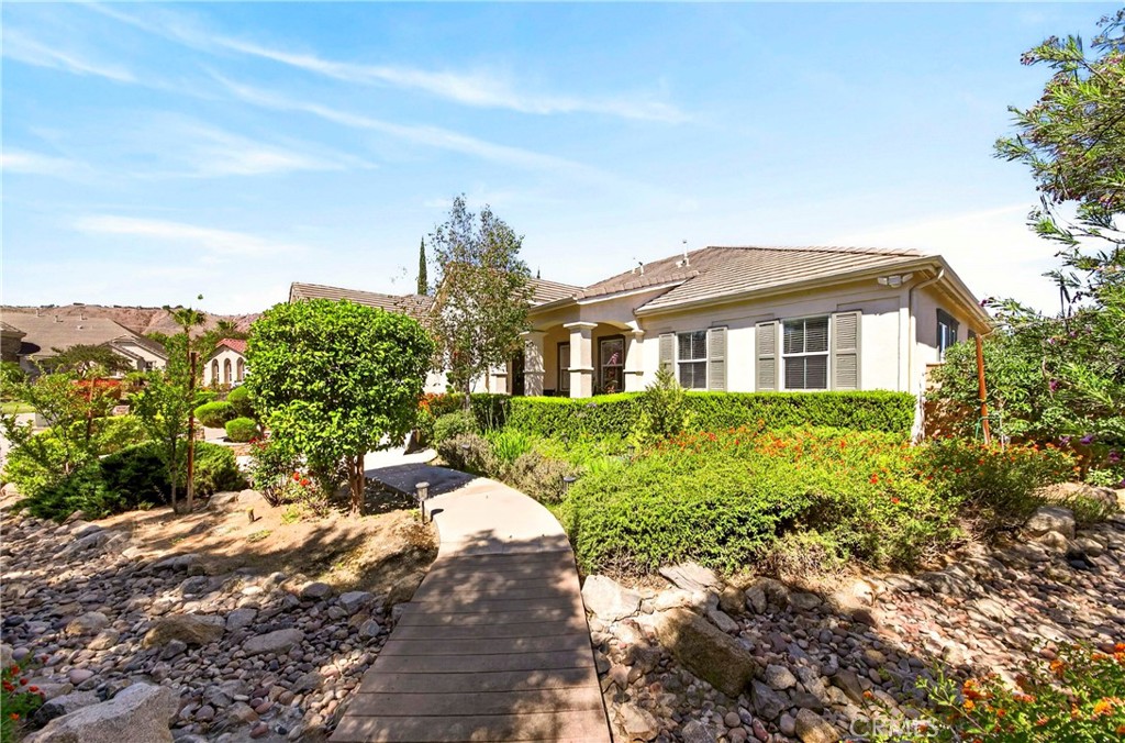 16375 Ory Circle Riverside, CA 92503 - Photo 4 of 51 a front view of a house with a yard and garage