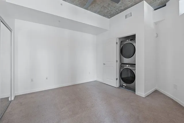 a utility room with a sink dryer and washer