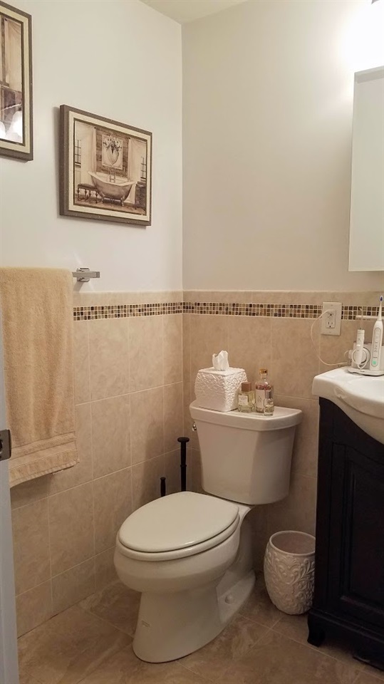525 Adams Street, Unit 4L Hoboken, NJ 07030 - Photo 7 of 7 a white toilet sitting next to a bathroom sink