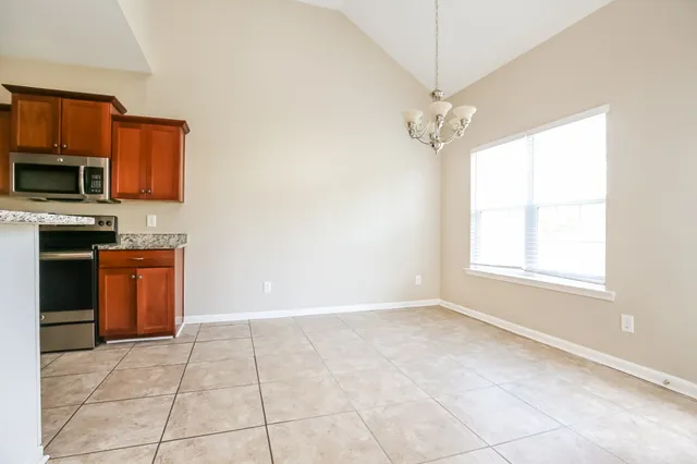 a view of a kitchen with a sink dishwasher and microwave