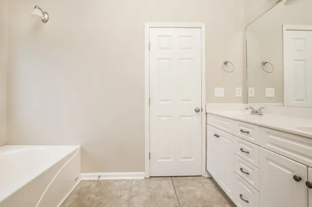 a bathroom with a sink and a bathtub