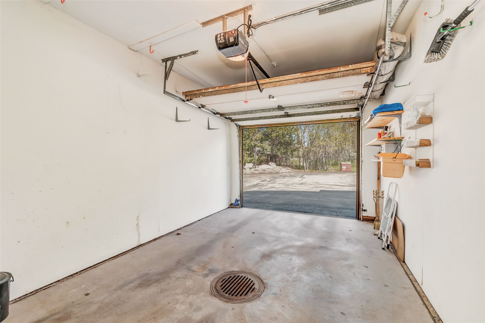 1675 Ranch Road, Unit 411 Steamboat Springs, CO 80487 - Photo 38 of 48 Garage featuring a garage door opener
