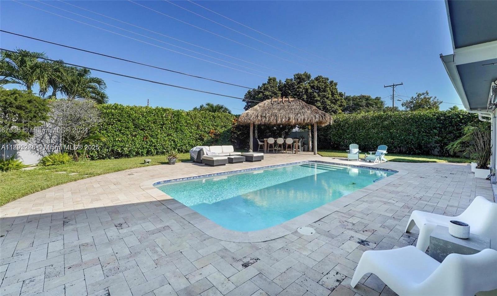 a view of a swimming pool with a patio