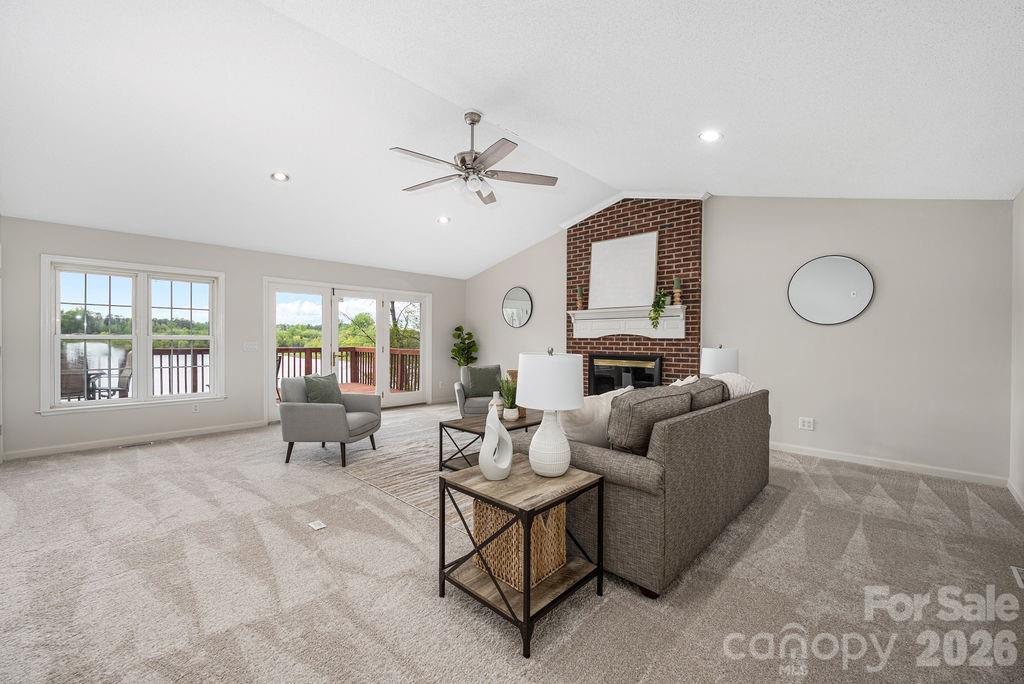349 Lake Wylie Road Belmont, NC 28012 - Photo 12 of 48 a living room with furniture and a large window