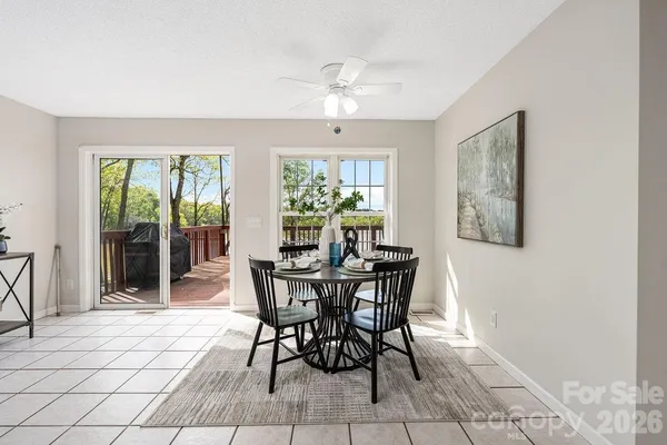 a view of a dining room with furniture and window