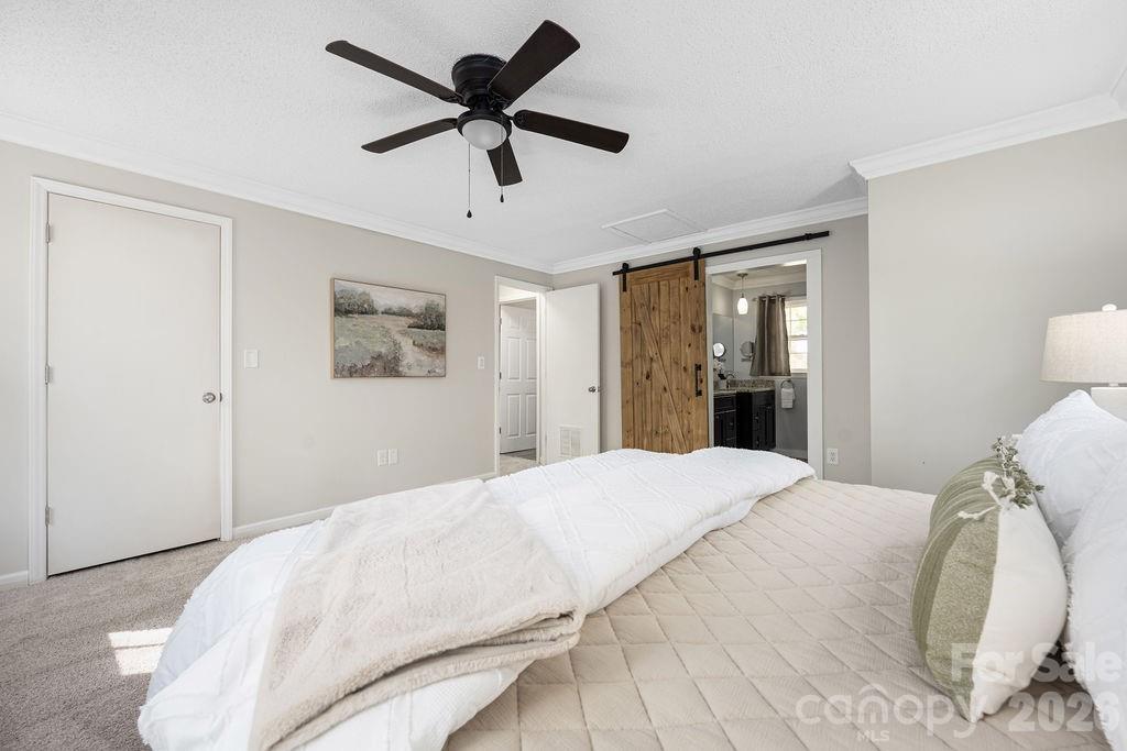 349 Lake Wylie Road Belmont, NC 28012 - Photo 27 of 48 a bedroom with a large bed and a window