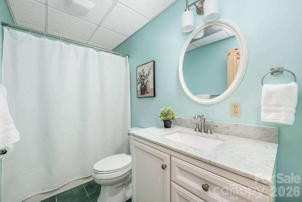 349 Lake Wylie Road Belmont, NC 28012 - Photo 36 of 48 a bathroom with a granite countertop toilet sink and mirror