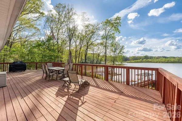 a view of a chairs on wooden deck