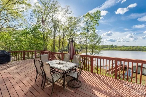 a view of a wooden deck with furniture
