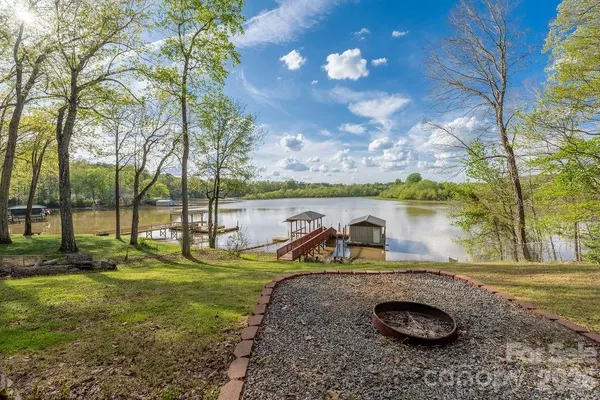 a view of a lake with a yard