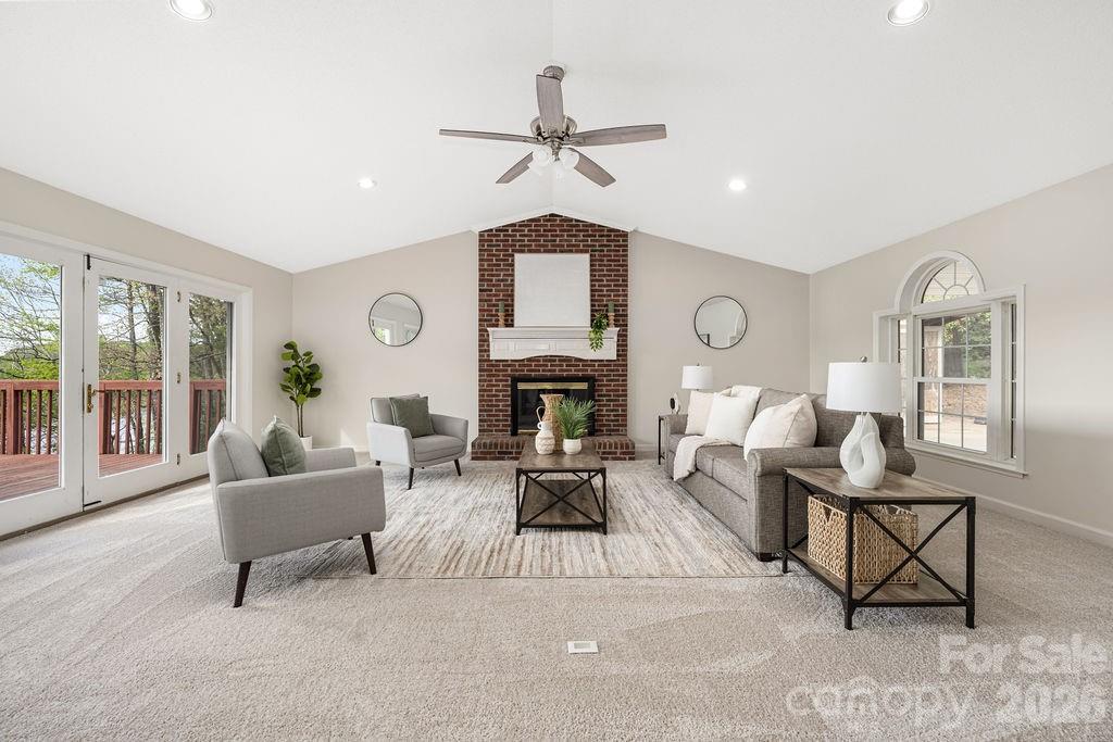 349 Lake Wylie Road Belmont, NC 28012 - Photo 8 of 48 a living room with furniture and a fireplace