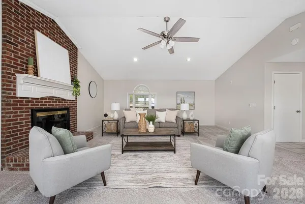 a living room with furniture a fireplace