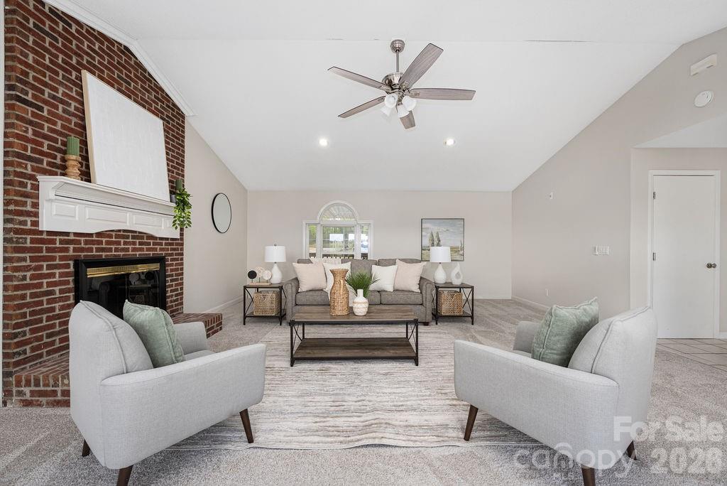 349 Lake Wylie Road Belmont, NC 28012 - Photo 9 of 48 a living room with furniture a fireplace