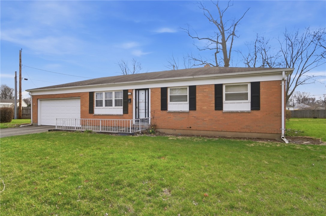 1087 Fairfield Road Troy, OH 45373 - Photo 3 of 39 This cozy home offers classic brick construction and an attached garage.