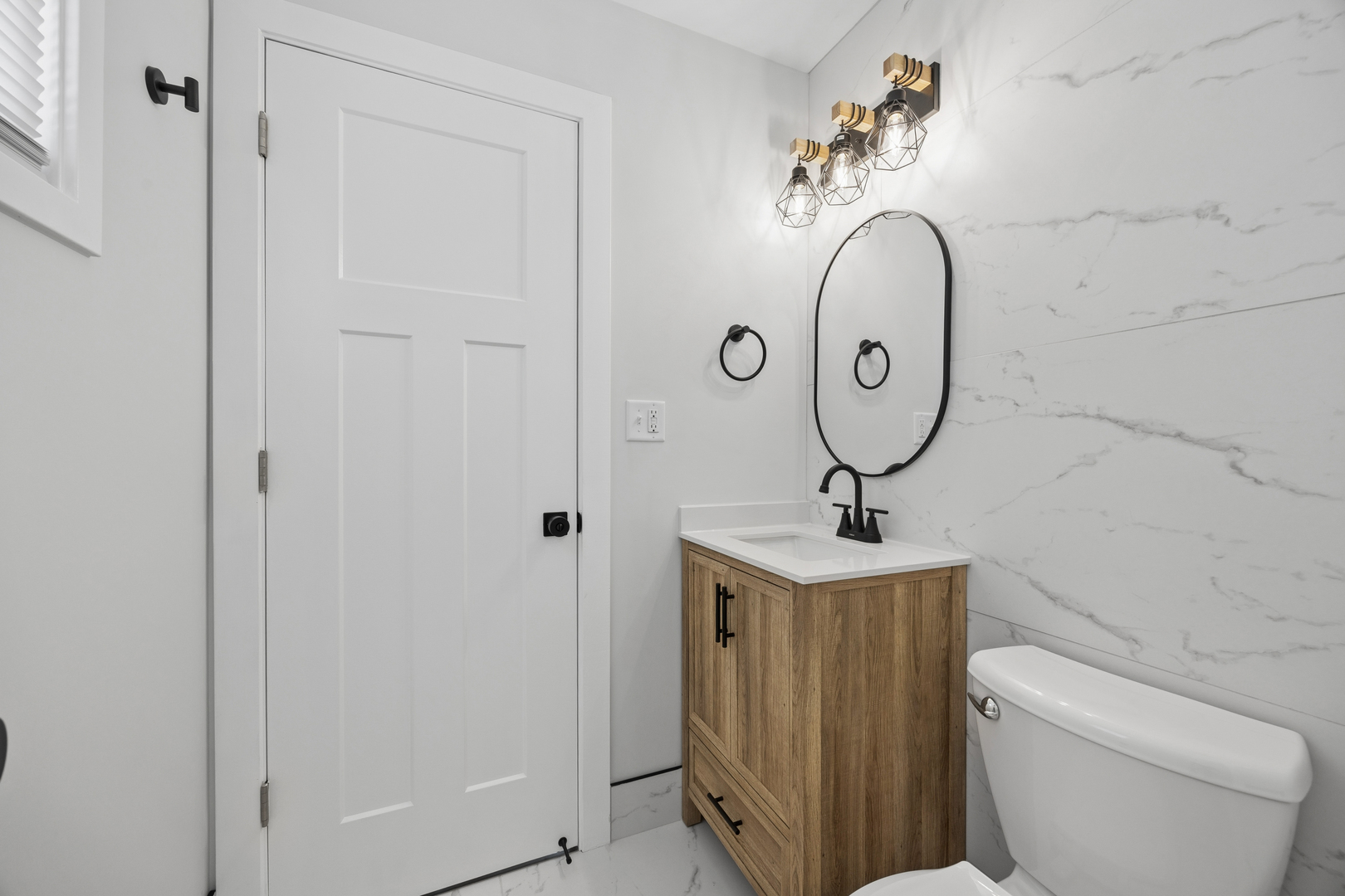 570 Andover Street Chicago Heights, IL 60411 - Photo 13 of 22 a bathroom with a toilet a sink and mirror