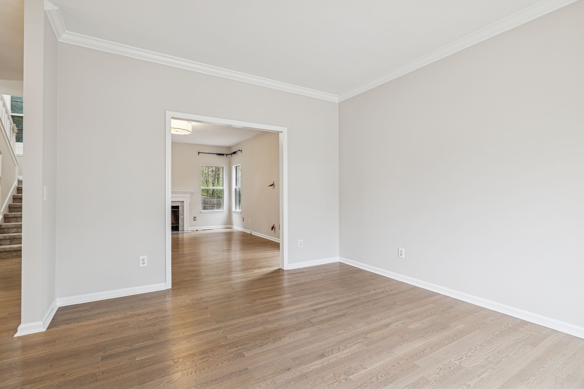 5244 Beech Ridge Road Nashville, TN 37221 - Photo 12 of 77 a view of a room with wooden floor and a ceiling fan