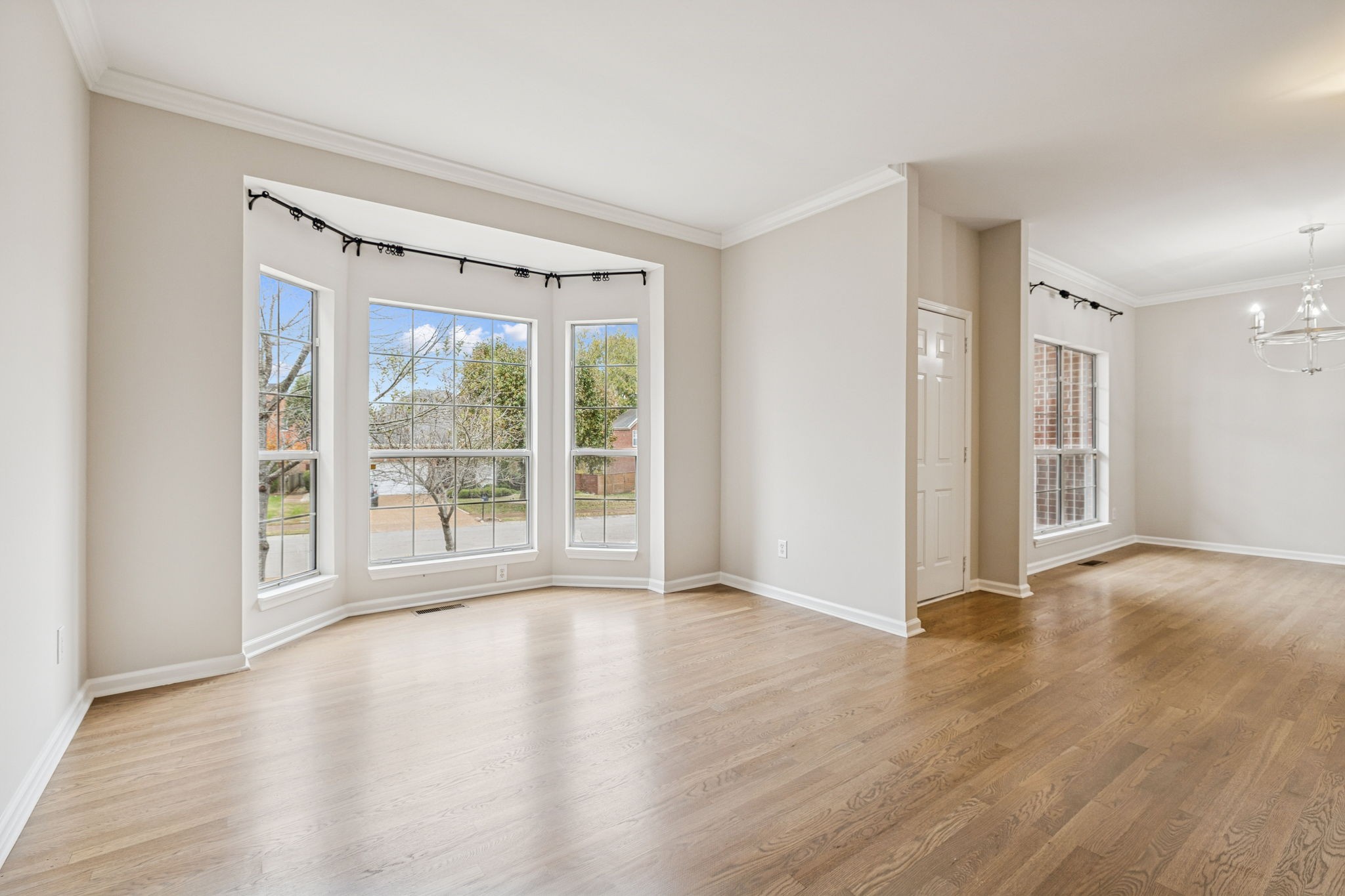 5244 Beech Ridge Road Nashville, TN 37221 - Photo 14 of 77 a view of an empty room with wooden floor and a window