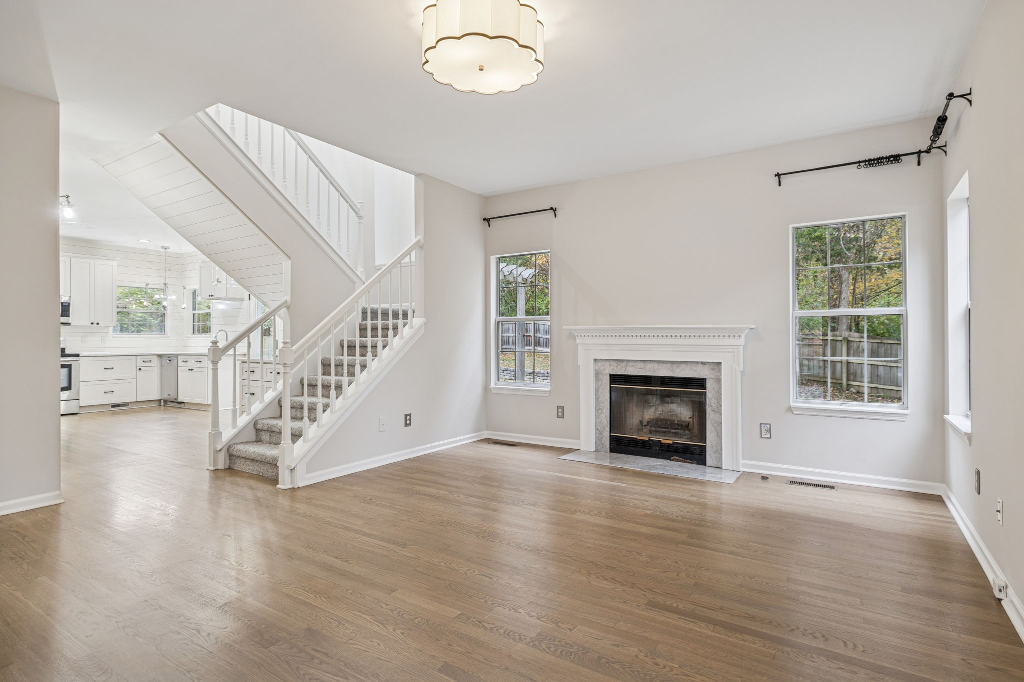 5244 Beech Ridge Road Nashville, TN 37221 - Photo 15 of 77 a view of an empty room with wooden floor fireplace and a window