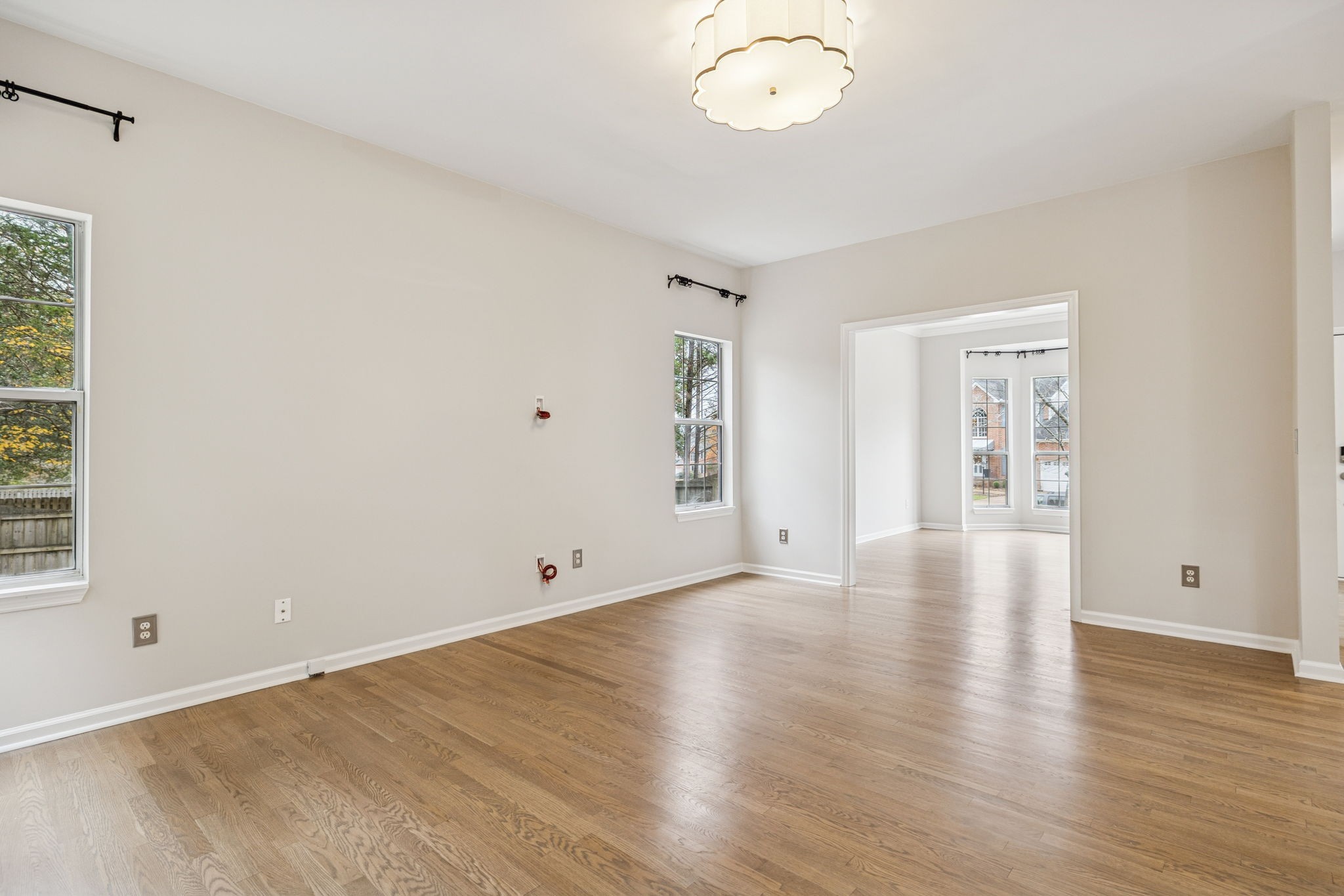 5244 Beech Ridge Road Nashville, TN 37221 - Photo 17 of 77 a view of an empty room with wooden floor and a window