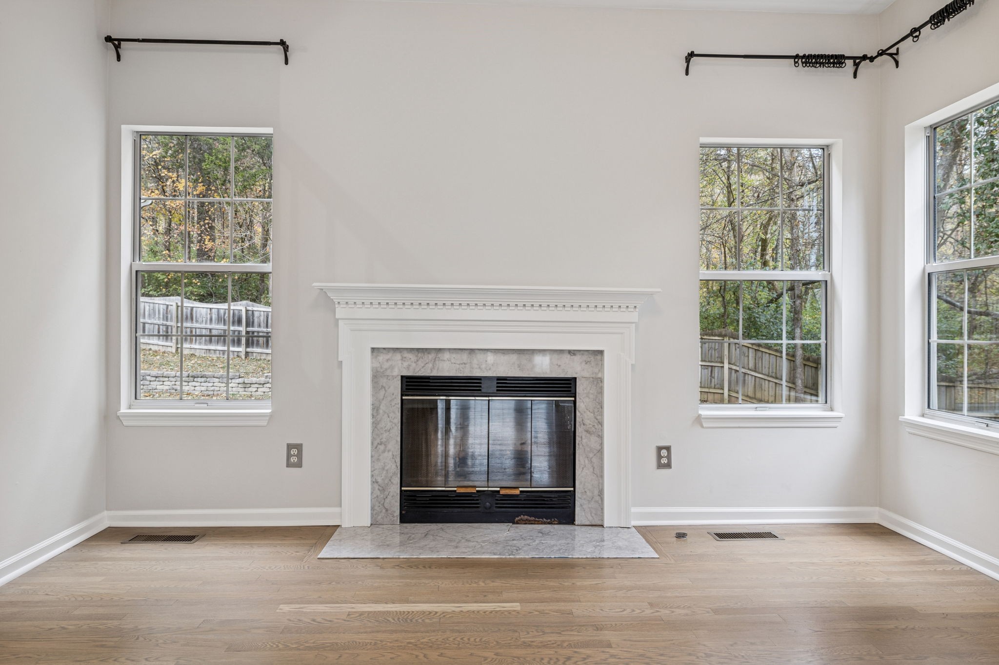 5244 Beech Ridge Road Nashville, TN 37221 - Photo 19 of 77 an empty room with fireplace and windows