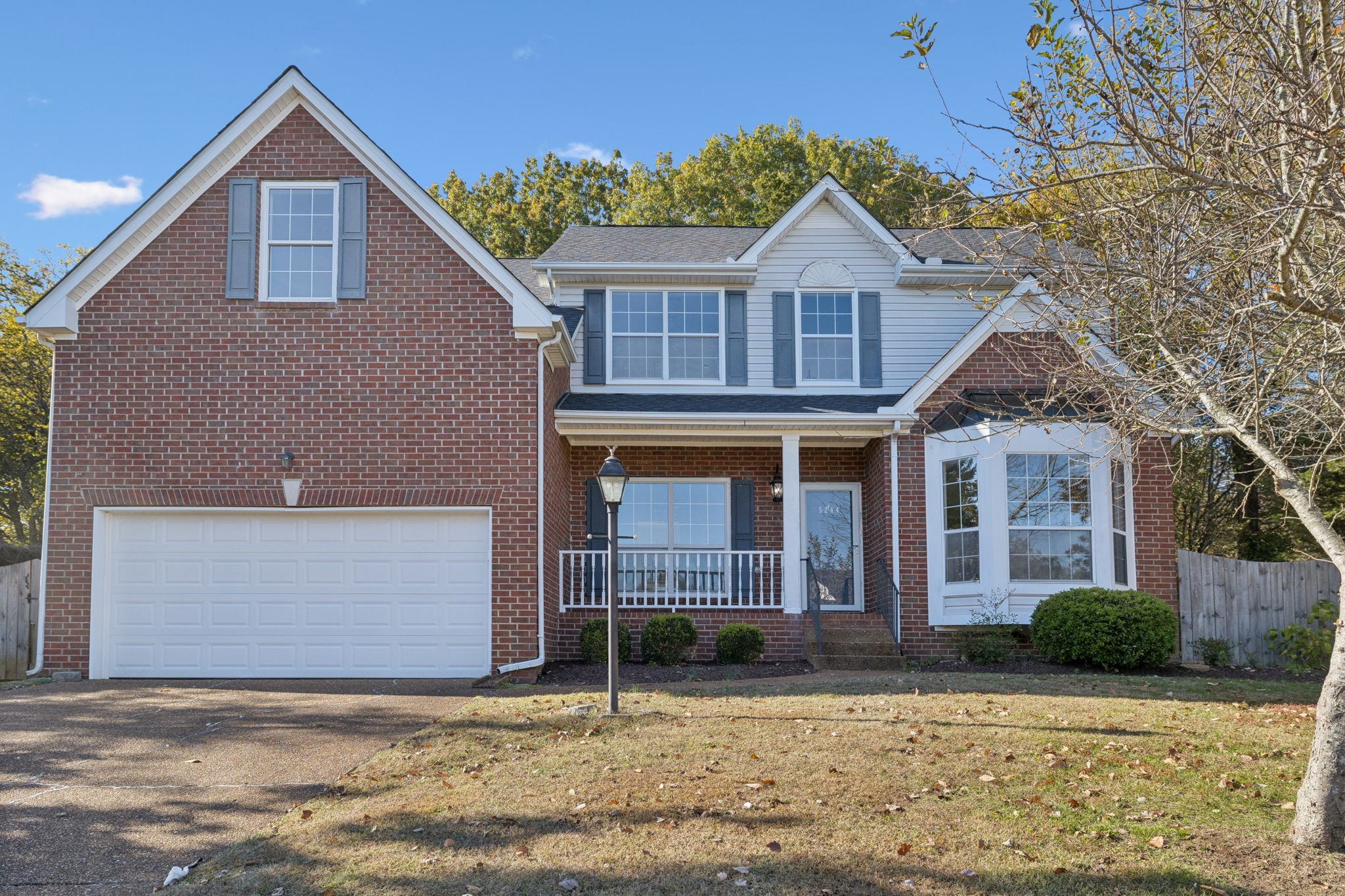 5244 Beech Ridge Road Nashville, TN 37221 - Photo 2 of 77 a front view of a house with garden