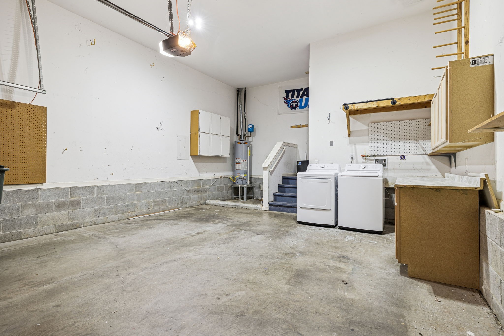 5244 Beech Ridge Road Nashville, TN 37221 - Photo 28 of 77 a utility room with cabinets dryer and washer