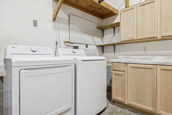 a bathroom with a tub sink and mirror