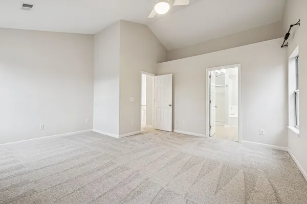 a bathroom with a granite countertop sink a toilet and shower