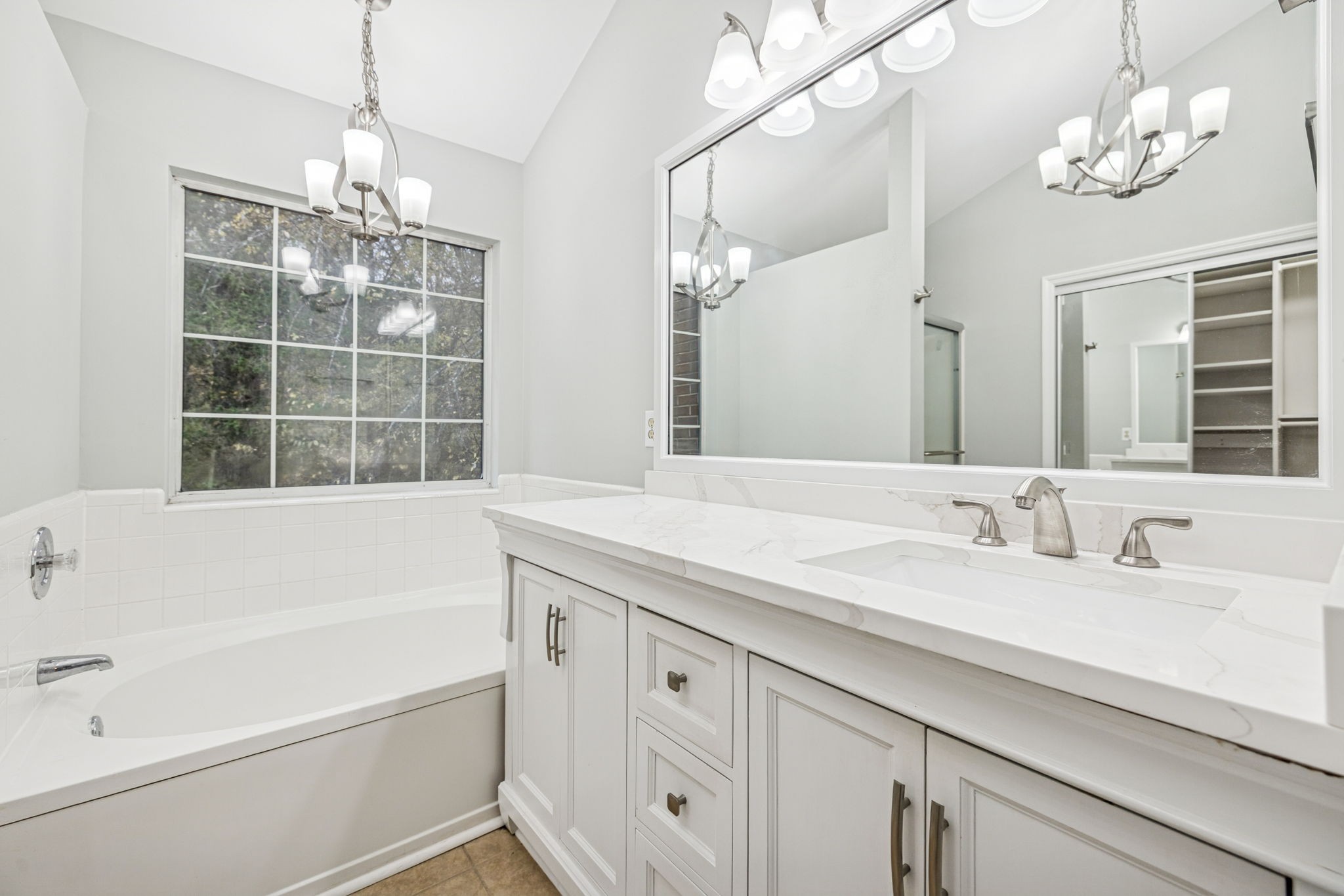 5244 Beech Ridge Road Nashville, TN 37221 - Photo 37 of 77 a bathroom with a tub sink and mirror