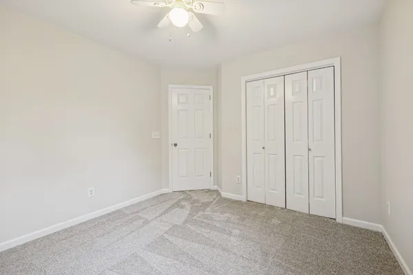 an aerial view of a house with a yard and outdoor seating