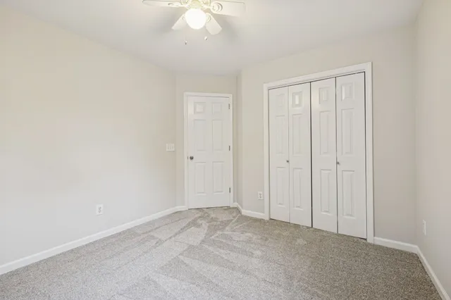 an aerial view of a house with a yard and outdoor seating