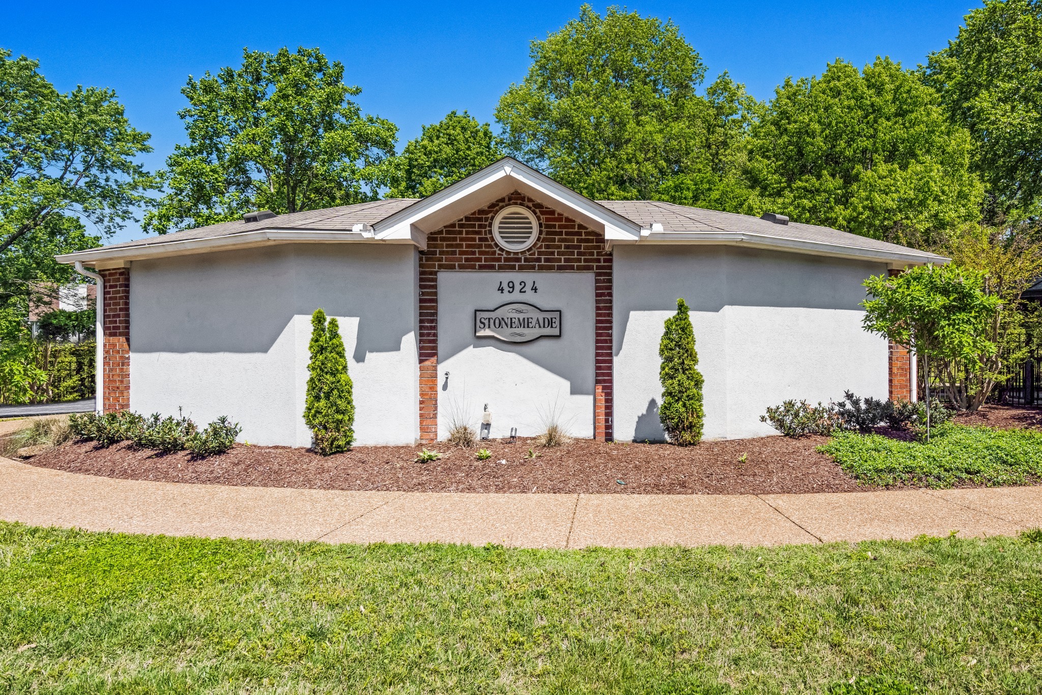 5244 Beech Ridge Road Nashville, TN 37221 - Photo 75 of 77 a front view of a house with a yard and garage