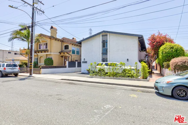 a front view of a house with a yard and a garage