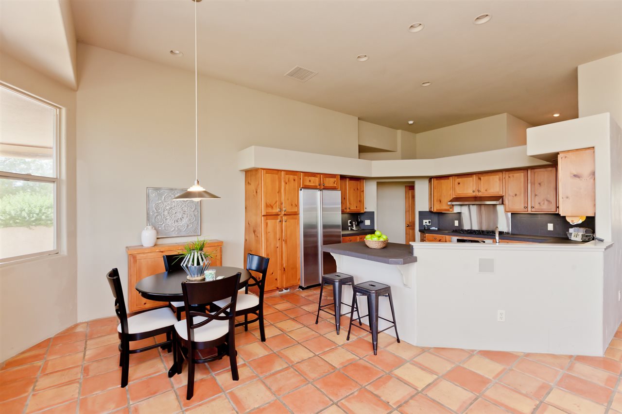 2573 I Road Grand Junction, CO 81505 - Photo 11 of 42 a kitchen with a table chairs and a refrigerator