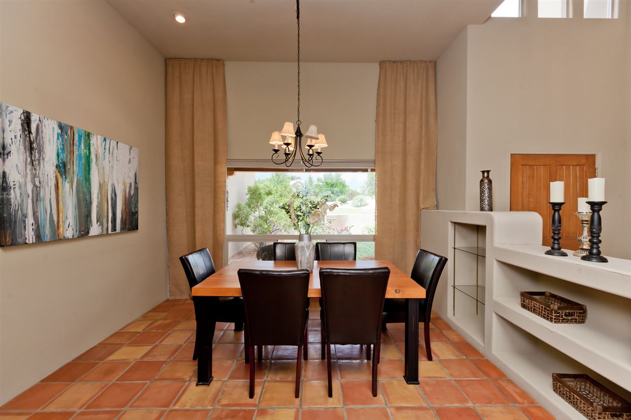 2573 I Road Grand Junction, CO 81505 - Photo 13 of 42 a view of a dining room with furniture a chandelier and wooden floor