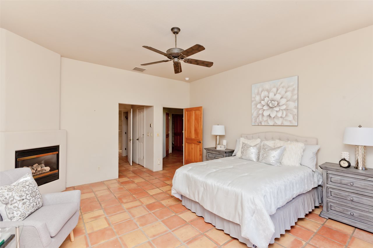 2573 I Road Grand Junction, CO 81505 - Photo 17 of 42 a bedroom with a large bed and a chandelier