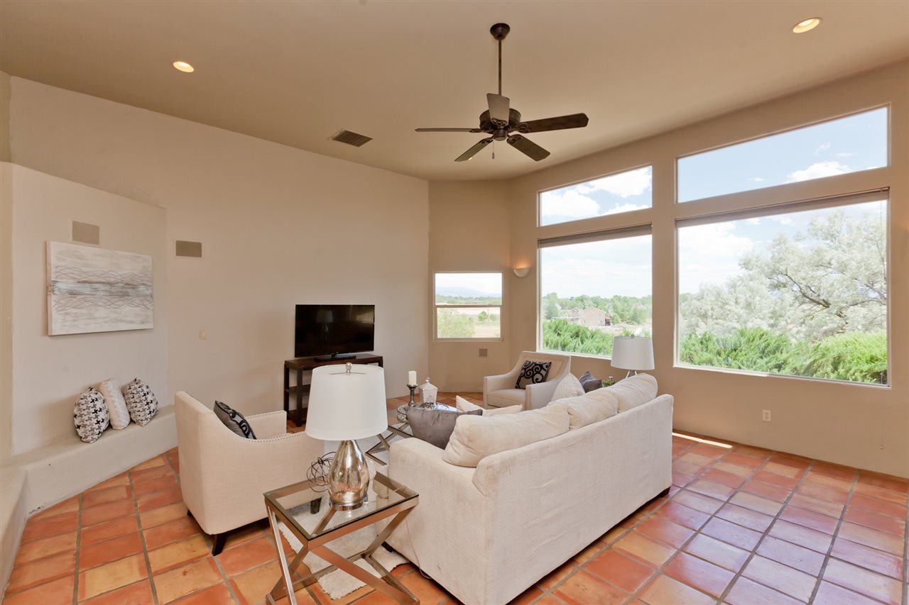 2573 I Road Grand Junction, CO 81505 - Photo 2 of 42 a living room with furniture and floor to ceiling windows