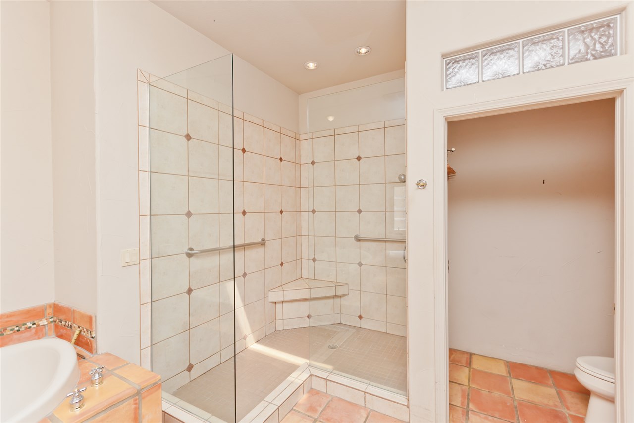 2573 I Road Grand Junction, CO 81505 - Photo 21 of 42 a bathroom with a bathtub and shower