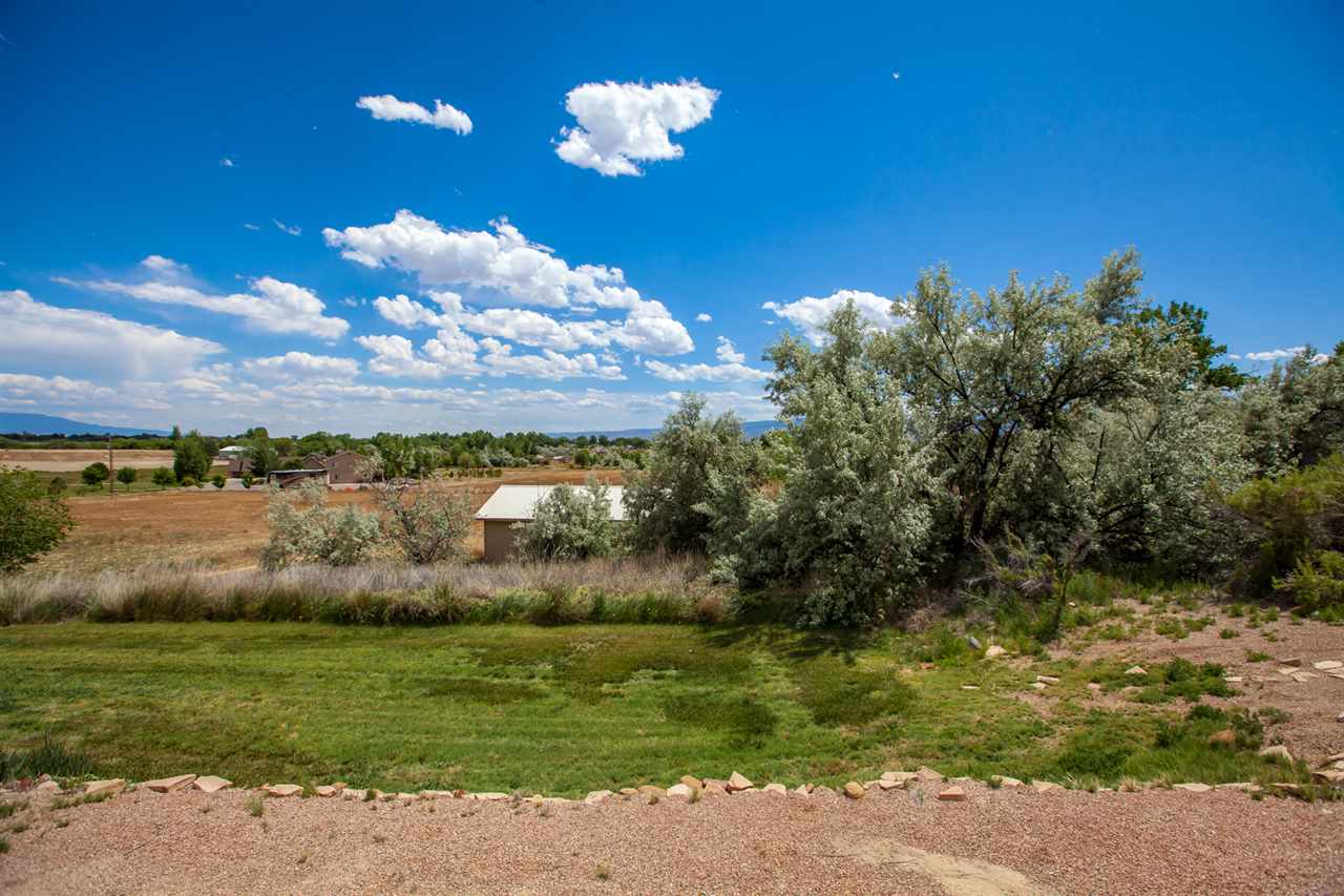 2573 I Road Grand Junction, CO 81505 - Photo 35 of 42 a view of a lake with a yard