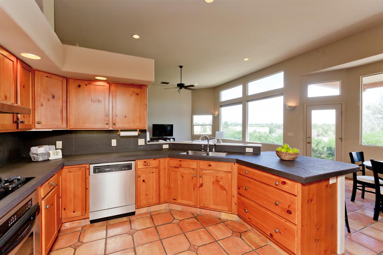 2573 I Road Grand Junction, CO 81505 - Photo 8 of 42 a kitchen with stainless steel appliances granite countertop a sink and a stove