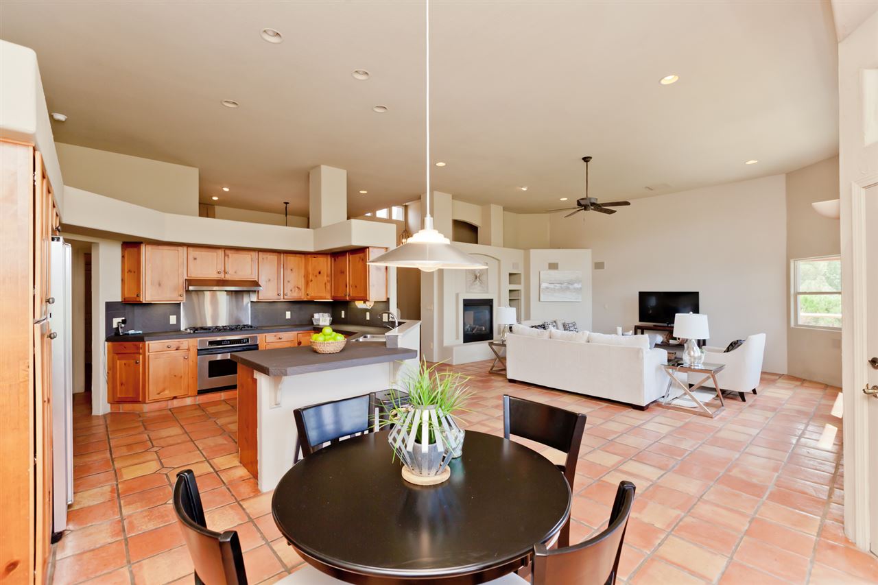 2573 I Road Grand Junction, CO 81505 - Photo 9 of 42 a living room with stainless steel appliances furniture a rug and a kitchen view