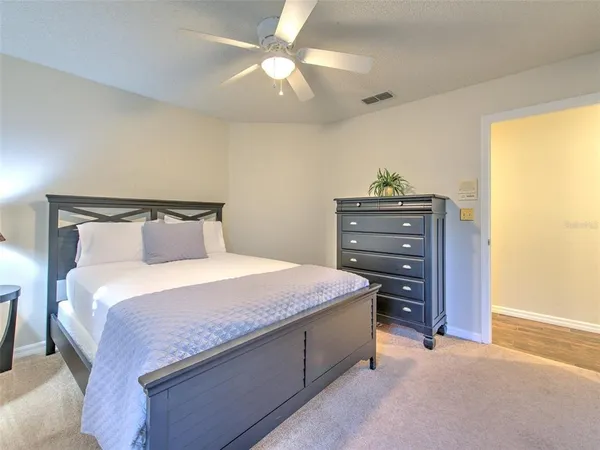 a bedroom with a bed and a dresser