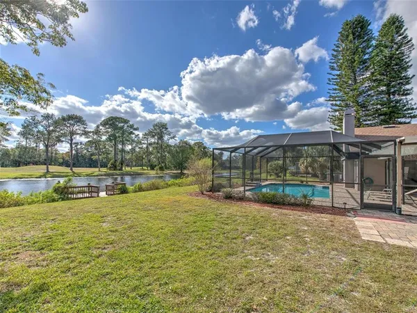 a view of a swimming pool with a patio
